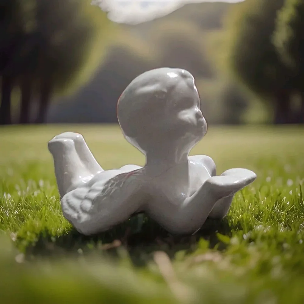 Vintage Glossy White Porcelain Laying Cherub Angel Figurine Shelf Sitter Decor